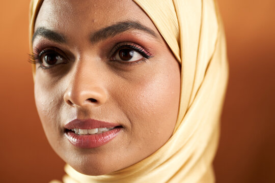 Muslim woman photographed against a seamless backdrop