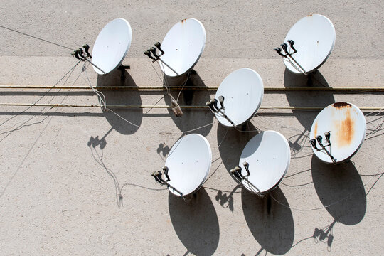 Satellite dishes on wall of a building