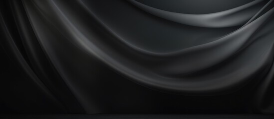 A black and white curtain is elegantly hanging in a room. The curtain features a classic design with a distinct contrast between the dark grey and black colors.