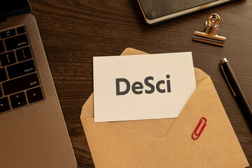 There is word card with the word DeSci. It is an abbreviation for DeSci as eye-catching image.