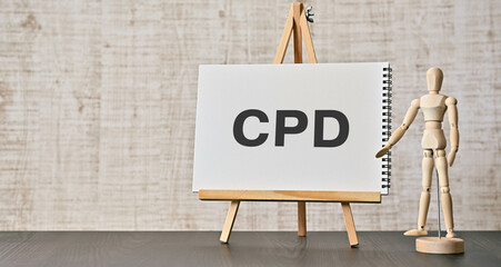 There is notebook with the word CPD. It is an abbreviation for Continuing Professional Development as eye-catching image.