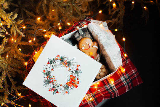 Festive Gift Box with xmas presents near decorated Christmas tree