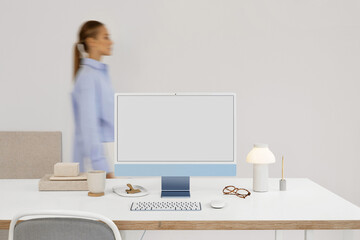 a business woman in a modern office near a computer with white screen