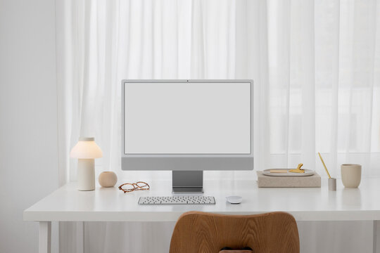 Mockup of a modern computer with white screen in a stylish office