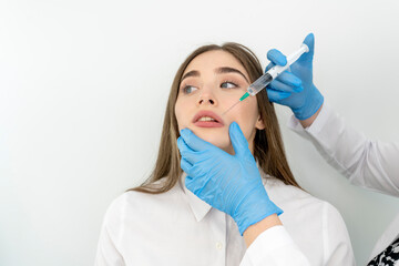 Woman getting cosmetic injection of botox near lips, closeup. Woman in beauty salon. plastic...