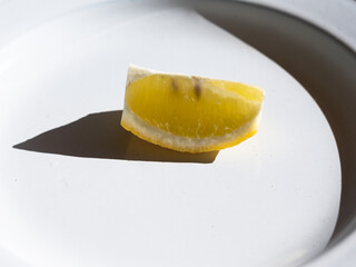 Section of lemon placed on a plate