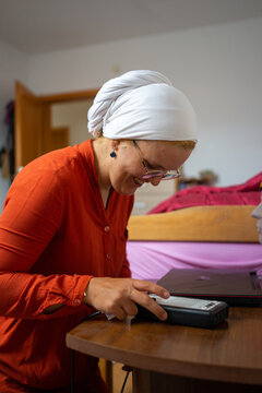 Muslim Student Setting up her Project