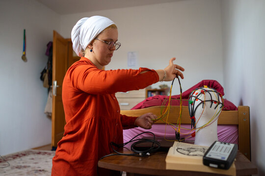 Muslim Student Assembling a Project 