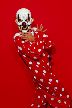 funny clown posing in a red costume