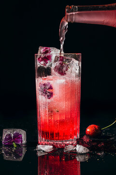 Making a Cherry and flower cocktail