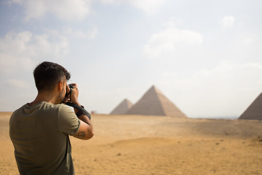 Photographer visiting the pyramids of Egypt.
