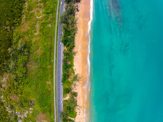 Aerial view seashore with road around the Phuket island Thailand, Beautiful seacoast view at open sea in summer season,Nature and Travel background