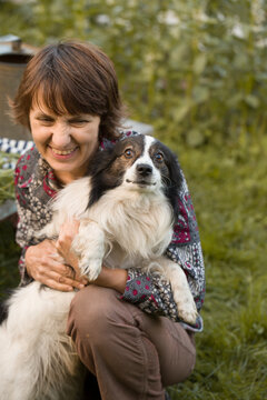 portrait of cheerful mature smiling woman ,animal lover 