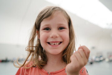 Happy girl lost her first tooth