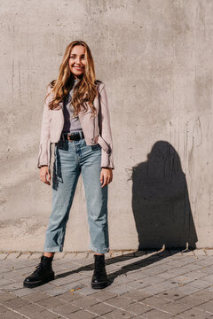 Portrait of a young and cheerful blonde girl on a sunny day