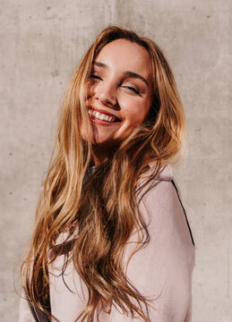 Stunning portrait of gorgeous young woman smiling at camera