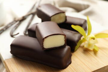 Glazed vanilla curd cheese bars on table, closeup