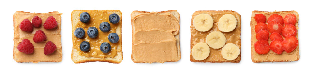 Different tasty peanut butter sandwiches isolated on white, top view