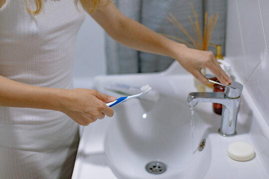 girl hands with toothbrush and toothpaste