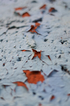 Detail of blue wall painting exposed to weathering flaking off