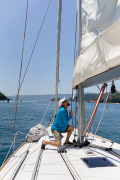 Man working on the yacht bow