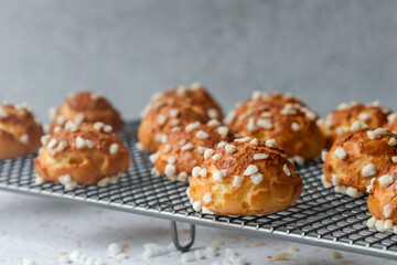Chouquettes presented on a baking rack 