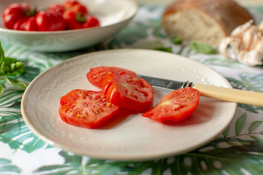 Sliced beefsteak tomatoes on a plate