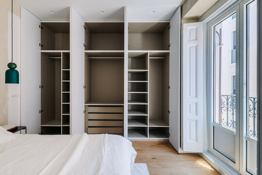 built-in closet with lots of empty compartments 