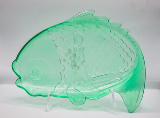Green glass plates shaped like fish