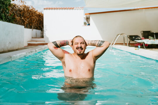 Plus-size male model in the pool