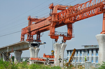 Huge orange dislocation bridge construction overhead crane