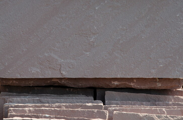 Brown surface of smooth sand stone block