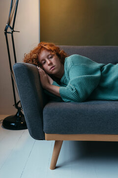 Unhappy red woman at home.