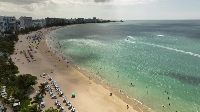 Aerial video above a hotel in San Juan Puerto Rico on the coastline, Latin America