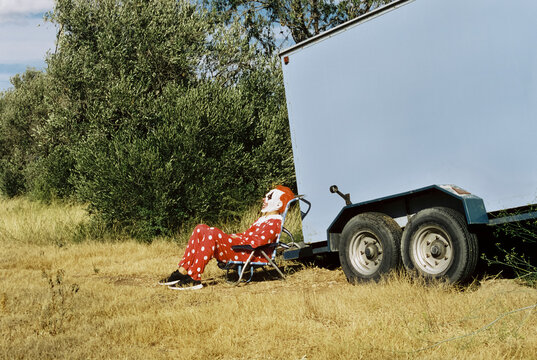 clown sitting out of his caravan, 35mm