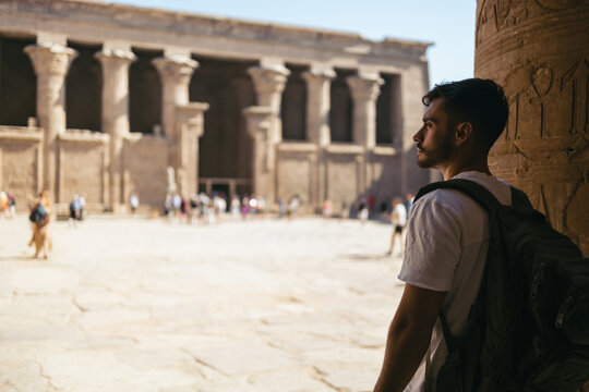 Man traveling in Egypt, visiting the Edfu Temple.