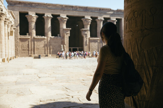 Woman traveling in Egypt, visiting the Edfu Temple.