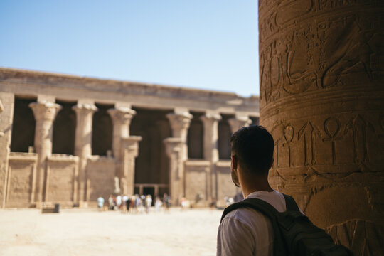 Man traveling in Egypt, visiting the Edfu Temple.