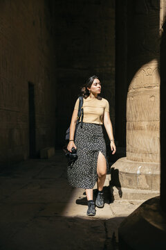 Woman traveling in Egypt, visiting the Edfu Temple.