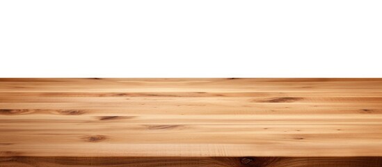 Fototapeta premium A detailed view of a brown wooden table placed against a plain white background. The table appears empty and is suitable for product placement or as a mock-up for product display.