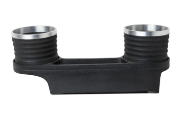 Interior view with  two cupholders and armrest of black used car stands in the showroom after dry washing before sale