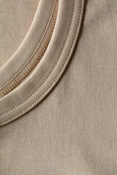 Clothing fabric with hem and stitching