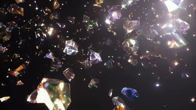 Sparkling gemstones of various colors emerge from the darkness, exploding with radiance.
