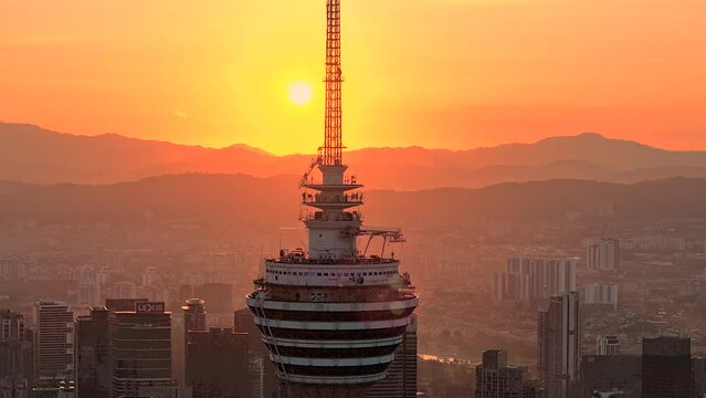 Kuala Lumpur, Malaysia. 15 February 2024. Kuala Lumpur City Scape 4k Aerial Footage during glowing sunrise.

