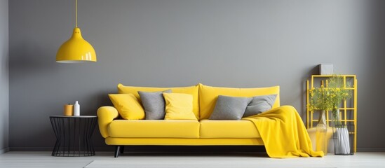 This modern living room features a bright yellow couch, a sleek table, and grey corner sofa. The yellow accents add a pop of color to the sleek and stylish interior design.