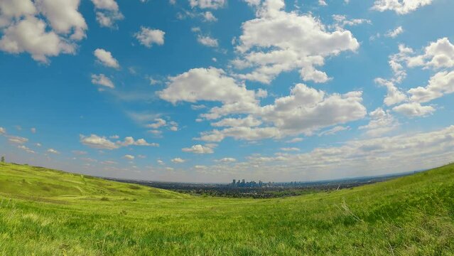 time-lapse cloudscapes fluffy clouds over the city. landscape with blue sky and clouds downtown view in sunny blue sky day. good environment for outdoor activities in summer perfect weather