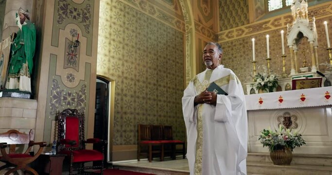 Priest, church and man with bible, religion or preach with Christianity and religious leader with Sunday morning service. Person, pastor or spiritual with worship or holy scripture with hope or faith