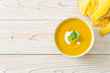 pumpkin soup in white bowl