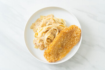 fettuccine pasta white cream sauce with fried fish