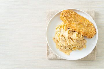 fettuccine pasta white cream sauce with fried fish